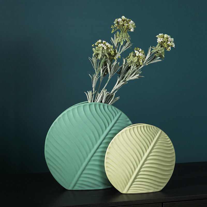 Ceramic vase with leaf ornament